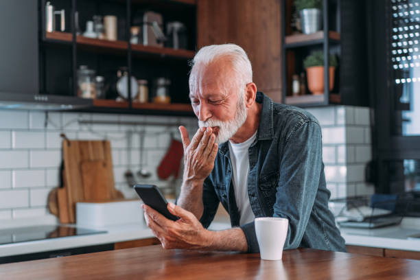 istock Cheerful man having video call at home. 1605405148