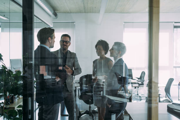 istock Business people in the office. 1605405163