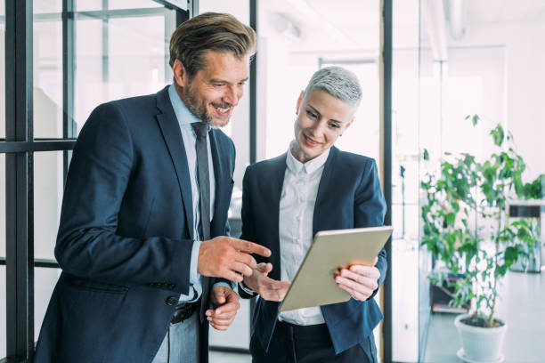 istock Business people in the office. 1605405185