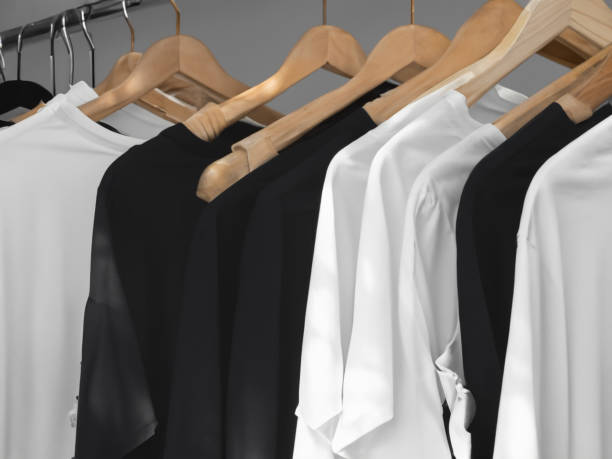 istock Realistic tshirt mockup | Blank black and white t-shirt on hanger, design mockup. Clear plain cotton tshirt mock up template. Apparel store logo mock branding display 1605405186