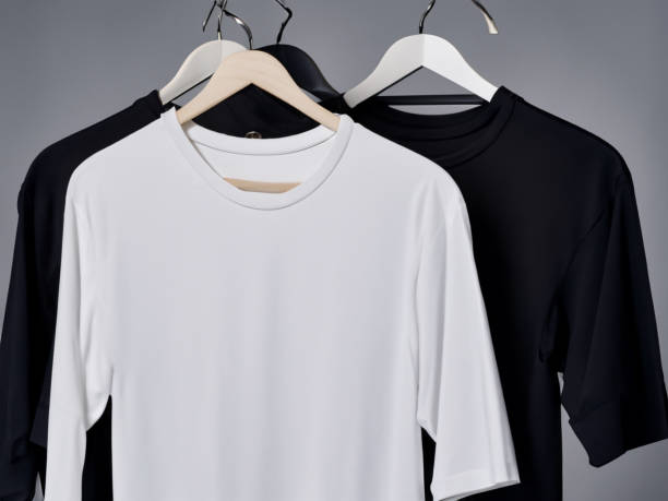 istock Realistic tshirt mockup | Blank black and white t-shirt on hanger, design mockup. Clear plain cotton tshirt mock up template. Apparel store logo mock branding display 1605405205
