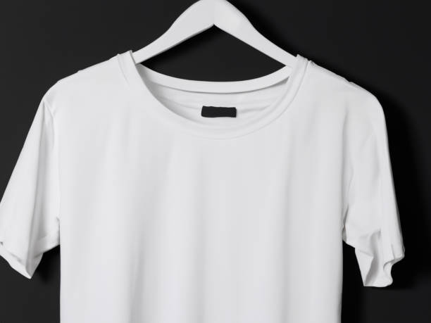 istock Realistic tshirt mockup | Blank black and white t-shirt on hanger, design mockup. Clear plain cotton tshirt mock up template. Apparel store logo mock branding display 1605407476