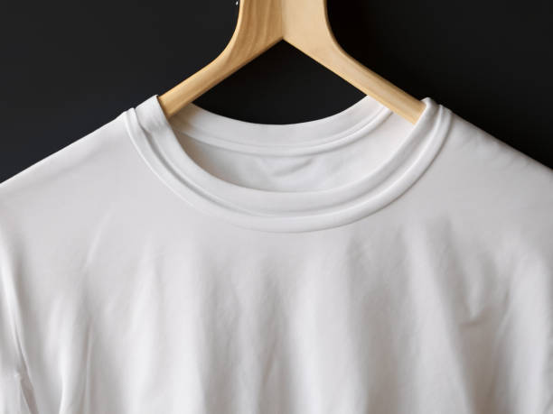 istock Realistic tshirt mockup | Blank black and white t-shirt on hanger, design mockup. Clear plain cotton tshirt mock up template. Apparel store logo mock branding display 1605410237