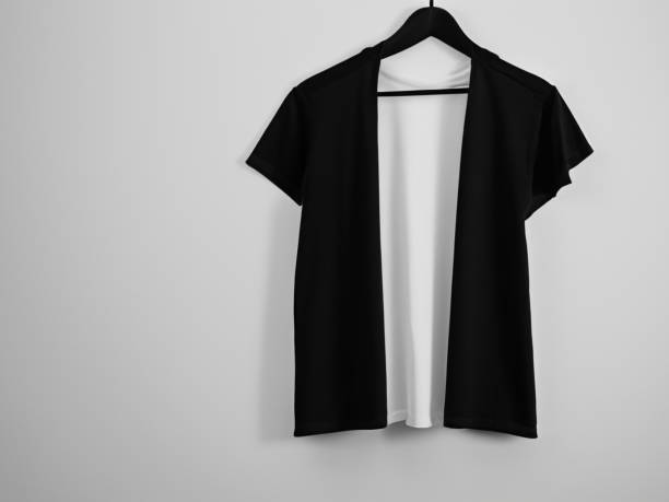 istock Realistic tshirt mockup | Blank black and white t-shirt on hanger, design mockup. Clear plain cotton tshirt mock up template. Apparel store logo mock branding display 1605410238