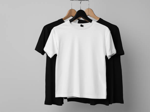istock Realistic tshirt mockup | Blank black and white t-shirt on hanger, design mockup. Clear plain cotton tshirt mock up template. Apparel store logo mock branding display 1605410805