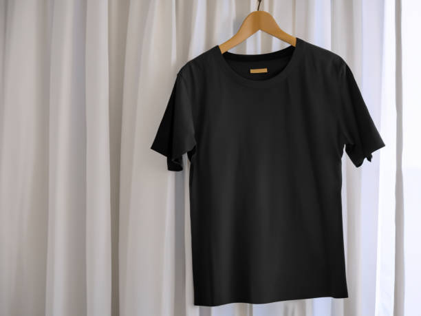 istock Realistic tshirt mockup | Blank black and white t-shirt on hanger, design mockup. Clear plain cotton tshirt mock up template. Apparel store logo mock branding display 1605411419