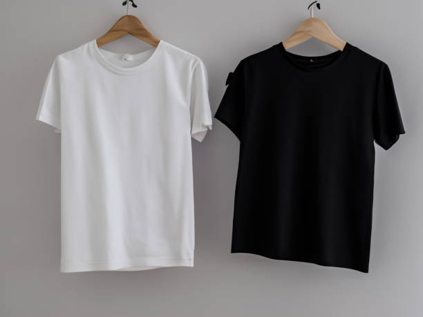 istock Realistic tshirt mockup | Blank black and white t-shirt on hanger, design mockup. Clear plain cotton tshirt mock up template. Apparel store logo mock branding display 1605411525