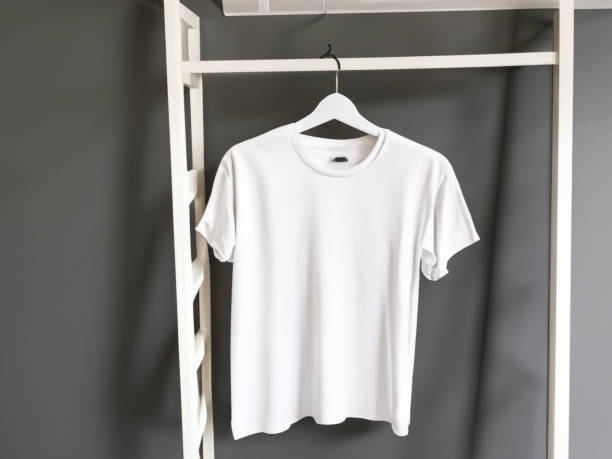 istock Realistic tshirt mockup | Blank black and white t-shirt on hanger, design mockup. Clear plain cotton tshirt mock up template. Apparel store logo mock branding display 1605412472