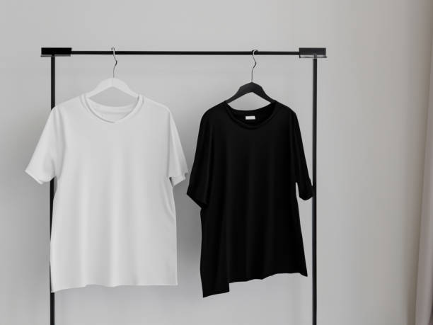 istock Realistic tshirt mockup | Blank black and white t-shirt on hanger, design mockup. Clear plain cotton tshirt mock up template. Apparel store logo mock branding display 1605413683