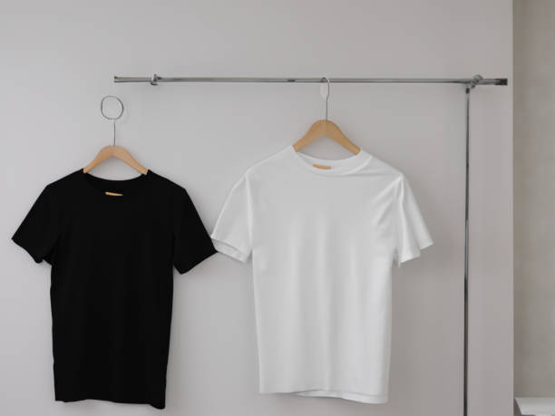 istock Realistic tshirt mockup | Blank black and white t-shirt on hanger, design mockup. Clear plain cotton tshirt mock up template. Apparel store logo mock branding display 1605414799