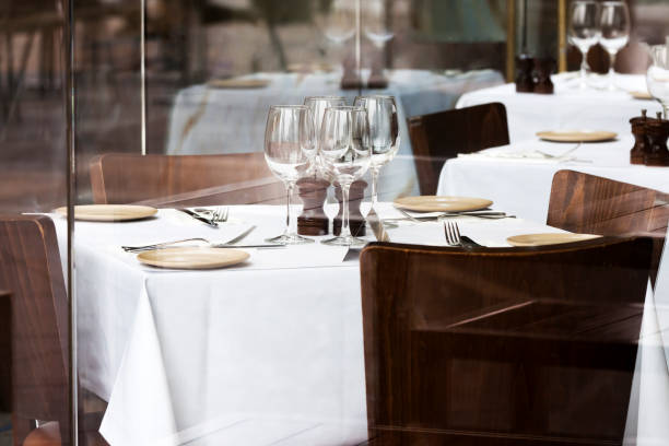 istock Restaurant with chairs, tables with white tablecloth and vine glasses 160541644