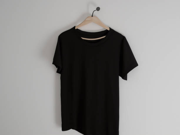 istock Realistic tshirt mockup | Blank black and white t-shirt on hanger, design mockup. Clear plain cotton tshirt mock up template. Apparel store logo mock branding display 1605417600