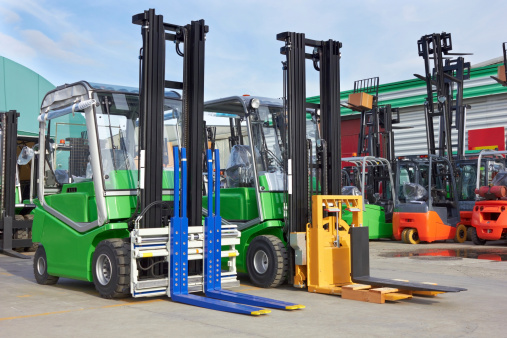 Electric forklift stackers in a row