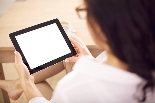 istock Woman Holding A Digital Tablet in Her Hands 160543660