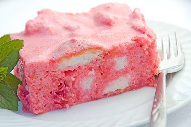 Cool summer refrigerator dessert mousse featuring angel food cake, strawberries, whipped cream/jello.