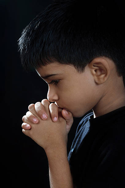 istock Portrait of Indian Boy Praying 160544004