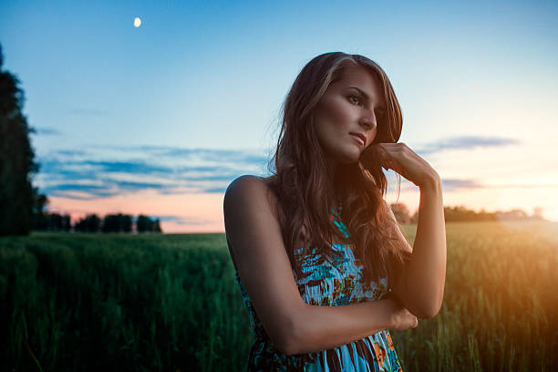 Portrait of a beautiful elegant girl at sunset stock photo