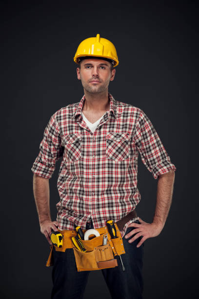 istock Portrait of handsome manual worker with tool belt 160544604