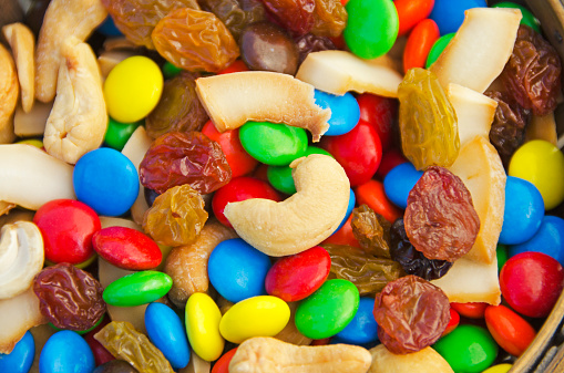 Trail mix with candy coated chocolate pieces, cashews, raisins and coconut.