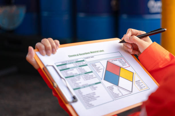 istock Checking on the chemical hazardous material form. Industrial safety working. 1605456986