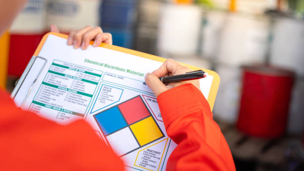 istock Checking on the chemical hazardous material form. Industrial safety working. 1605456989