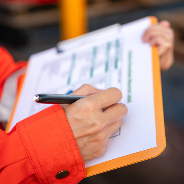 istock Checking on the chemical hazardous material form. Industrial safety working. 1605457567