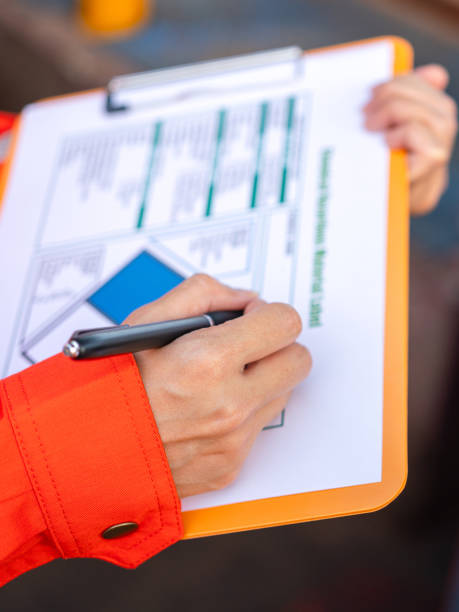 istock Checking on the chemical hazardous material form. Industrial safety working. 1605457586