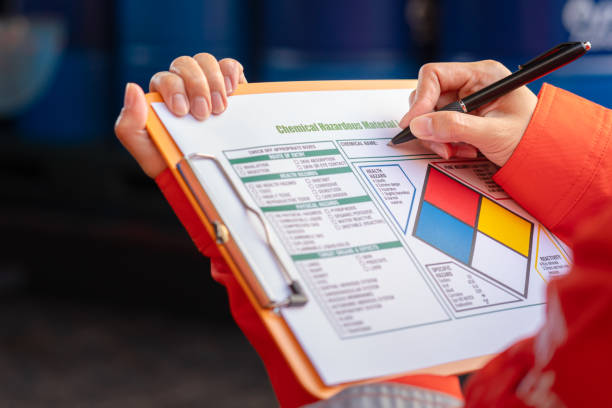istock Checking on the chemical hazardous material form. Industrial safety working. 1605457597