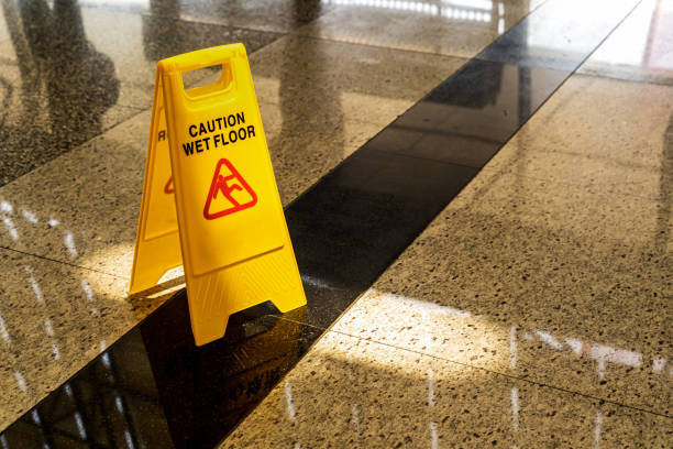 istock Sign showing warning of caution wet floor. 1605460404