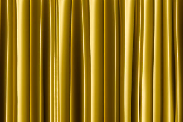 istock golden curtain in theatre. 1605462151