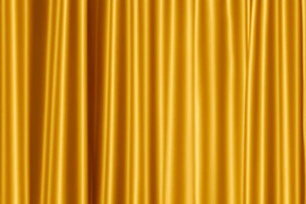 istock golden curtain in theatre. 1605462169