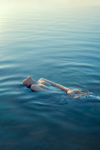 istock Beautiful redhead woman as mermaid 1605466252