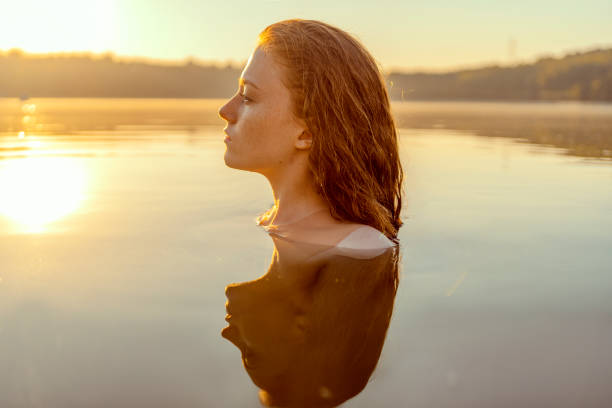 istock Beautiful redhead woman as mermaid 1605468018