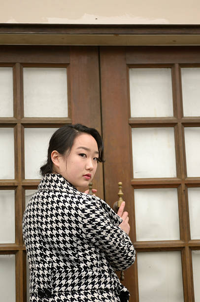 Young asian woman and door stock photo