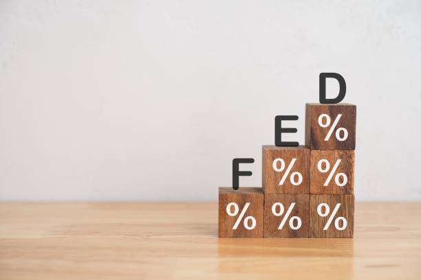 istock Wooden cube block stacking as stair or graph with word FED and percentage % sign. 1605471510