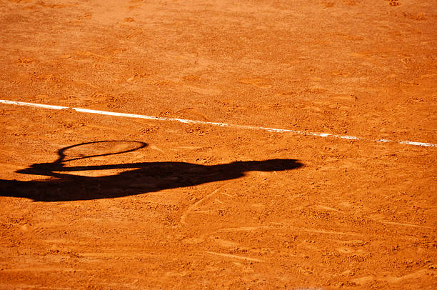 istock Player shadow on a clay tennis court 160547195