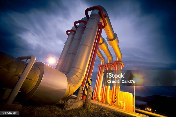 Close Up View Of A Pipeline At Night Stock Photo - Download Image Now - Built Structure, Chemical Plant, Construction Industry