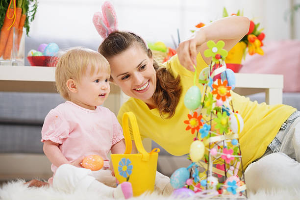 istock Mother and baby making Easter decoration 160550125