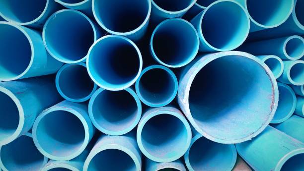 istock Blue Pvc pipes arranged on shelves 1605527228