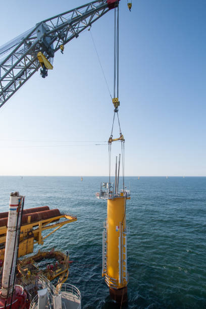 istock Offshore installation of a wind turbine foundation 1605554015