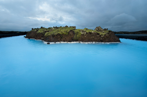 This is a geothermal pool located near the city of Grindavik, Iceland. Geothermal pools such as this get their blue coloring from minerals naturally found in the water.