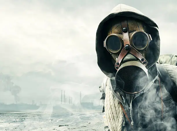 Environmental disaster. Post apocalyptic survivor in gas mask