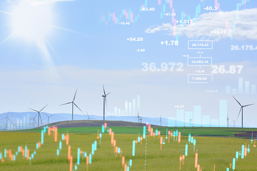 Energy prices rising concepts. Finance and economic growth in energy costs. Wind turbines with financial graphs, analyzing data of power and energy prices