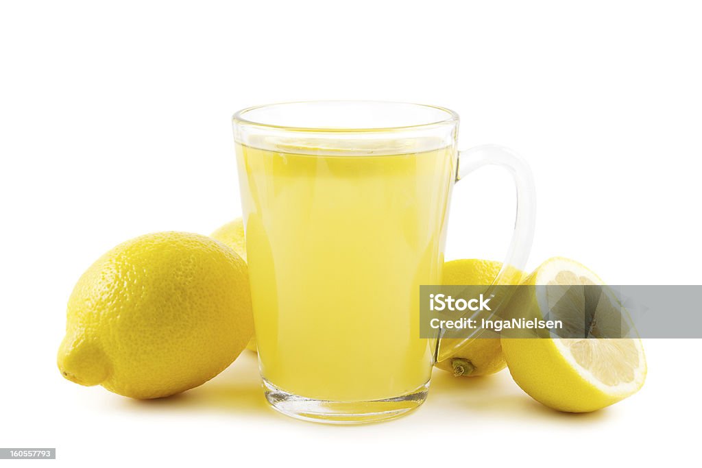 Hot lemon drink Cup of healthy hot lemon drink on white. Drinking Glass Stock Photo