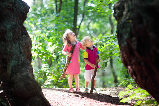 istock Kids play in autumn park 1605580019