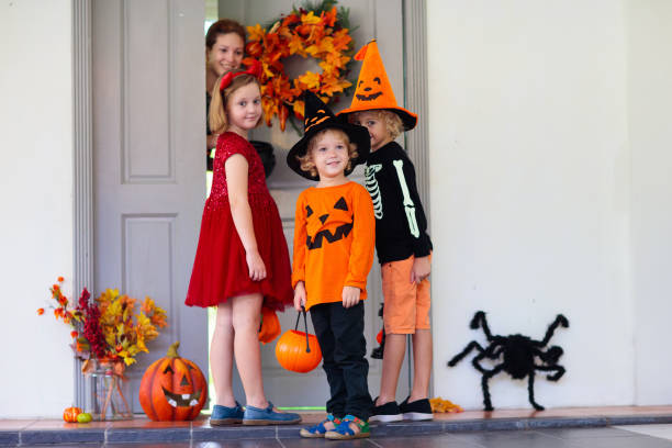 istock Kids trick or treat. Halloween fun for children. 1605589607