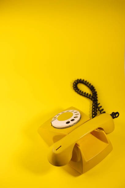 istock yellow bright retro telephone 1605589628