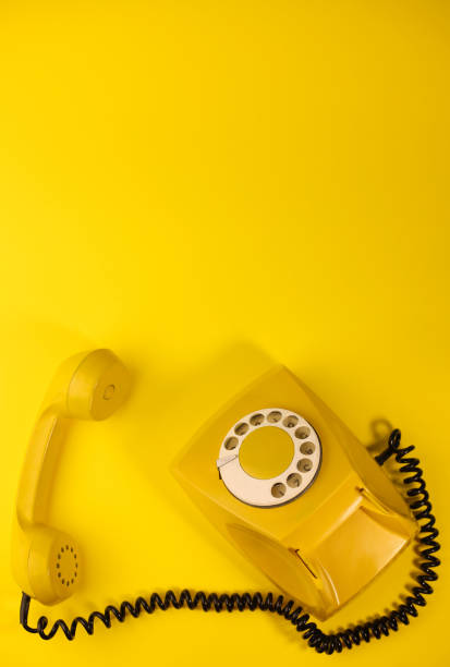 istock yellow bright retro telephone 1605589629