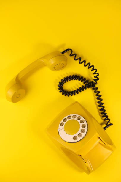 istock yellow bright retro telephone 1605589644