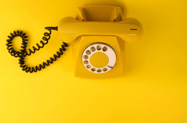 istock yellow bright retro telephone 1605589647